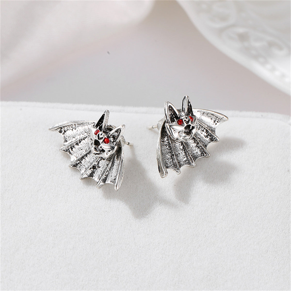 Red Cubic Zirconia and Silver-Plated Bat Stud Earrings, silver stud earrings for women, vintage-inspired design, styled look