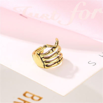 18K Gold-Plated Skeleton Hand Ear Cuff, gold stud earrings for women, vintage-inspired design, detail close-up