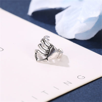 Silver-Plated Skeleton Hand Ear Cuff, silver stud earrings for women, dainty minimalist design, front view