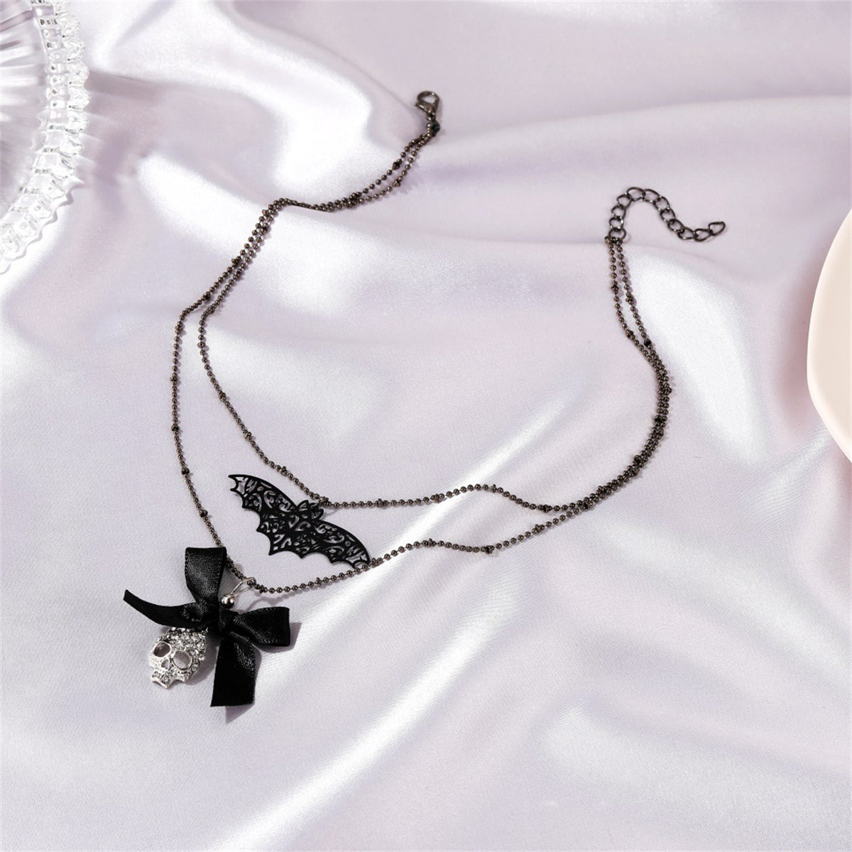 Cubic Zirconia and Silver-Plated Bat Bow Layered Pendant Necklace, silver pendant necklace for women, detail close-up