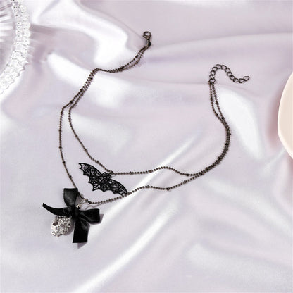 Cubic Zirconia and Silver-Plated Bat Bow Layered Pendant Necklace, silver pendant necklace for women, detail close-up