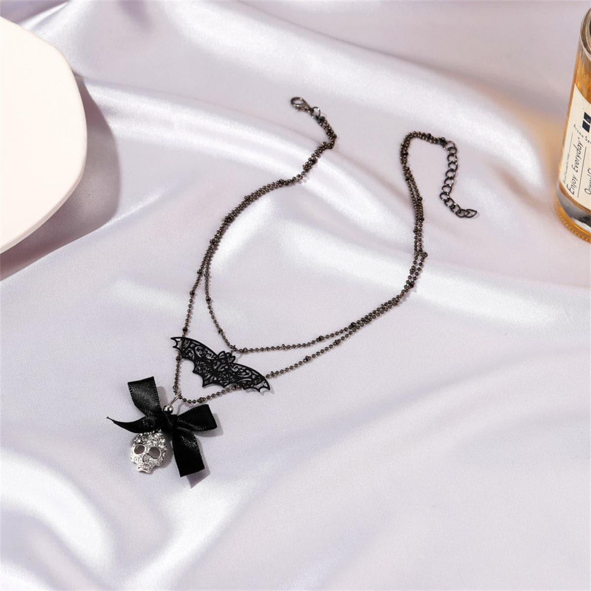 Cubic Zirconia and Silver-Plated Bat Bow Layered Pendant Necklace, silver pendant necklace for women, front view