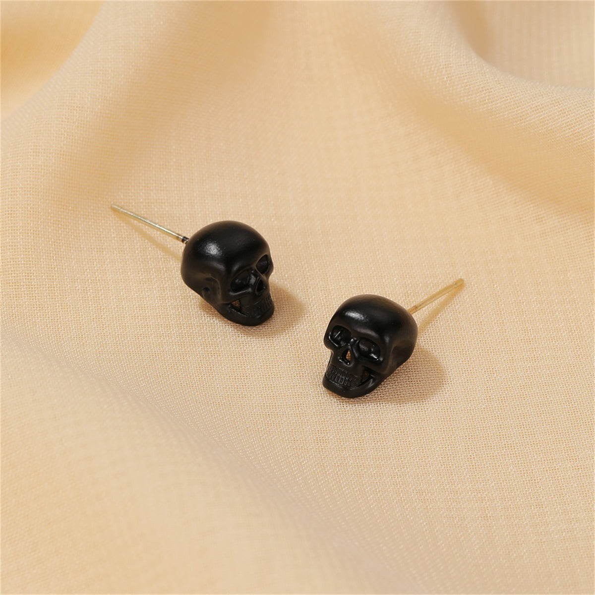 Black Skull Stud Earrings, stud earrings for women, dainty minimalist design, front view