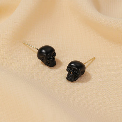 Black Skull Stud Earrings, stud earrings for women, dainty minimalist design, front view
