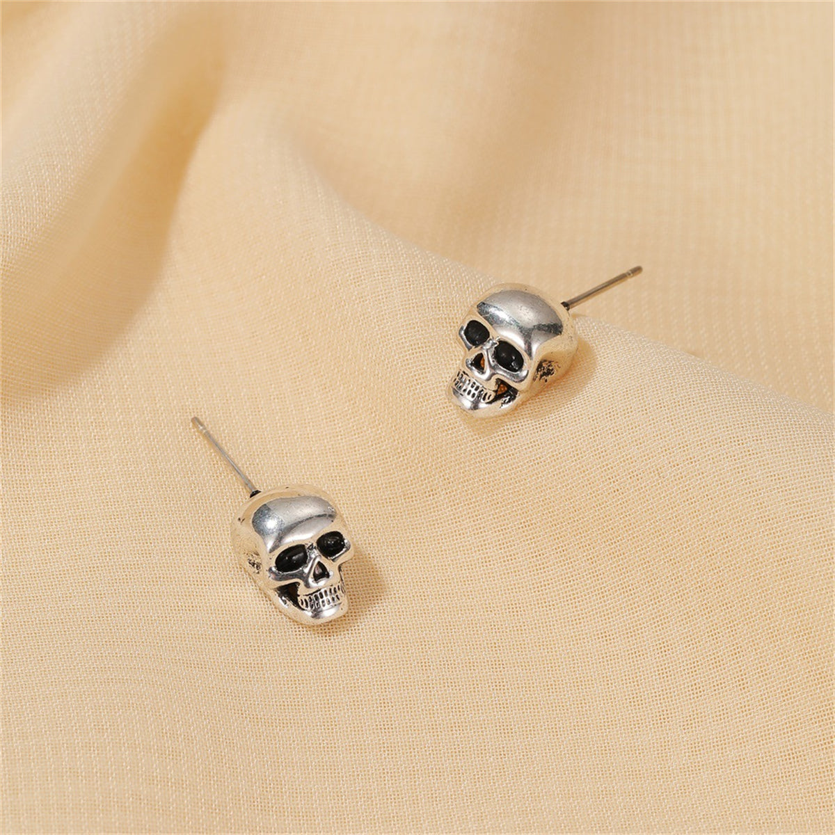 Silver-Plated Skull Stud Earrings, silver stud earrings for women, botanical inspired, front view