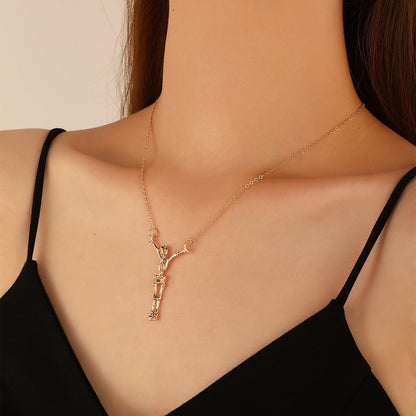 18K Gold-Plated Hanging Skeleton Pendant Necklace, gold pendant necklace for women, dainty minimalist design, lifestyle look
