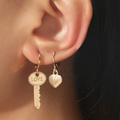 Elegant 18K gold-plated heart and key charms inscribed with 'love', ideal for expressing your heartfelt emotions.