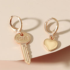Dazzling gold heart and key charms with 'love' inscriptions, embodying a perfect blend of elegance and sentiment.