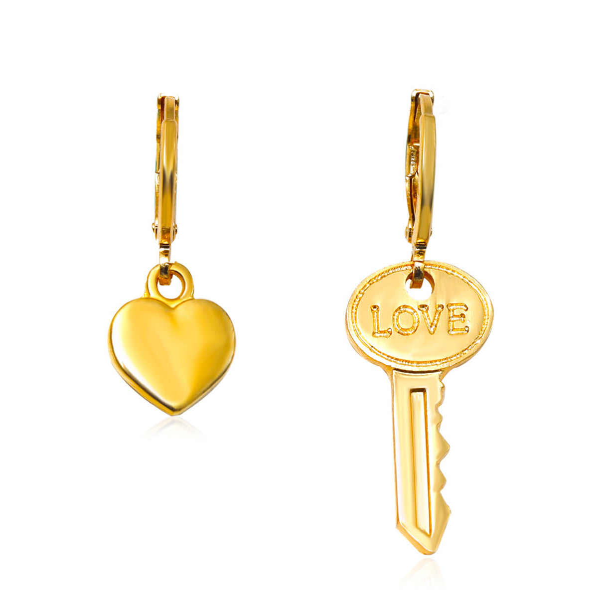 Stunning asymmetric huggie earrings with gold heart and key charms, beautifully engraved with 'love' for a romantic touch.