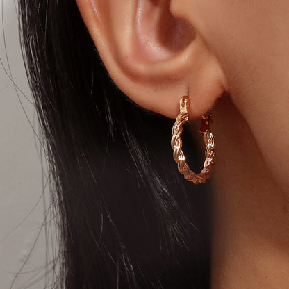 18K Gold-Plated Twisted Huggie Earrings, gold huggie earrings, dainty minimalist design, detail close-up