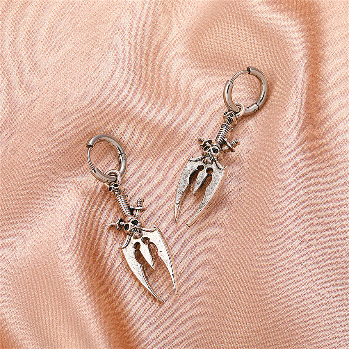Silver-Plated Skull Trident Drop Earrings, silver huggie earrings, vintage-inspired design, lifestyle look