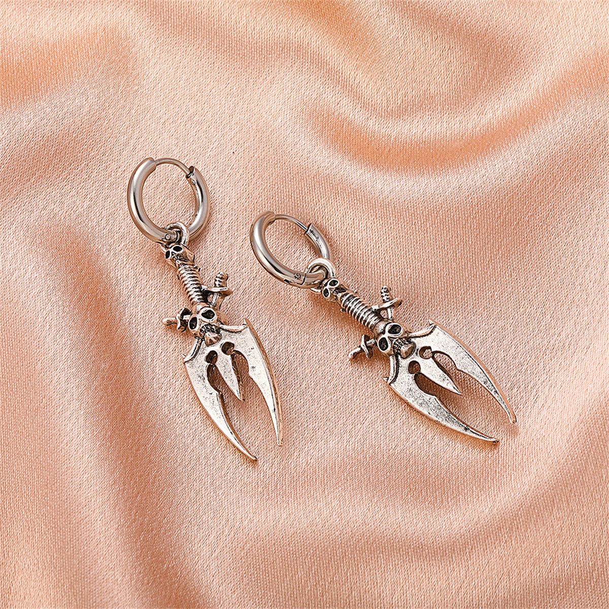 Silver-Plated Skull Trident Drop Earrings, silver huggie earrings, vintage-inspired design, styled look