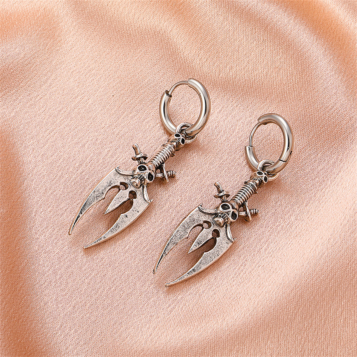 Silver-Plated Skull Trident Drop Earrings, silver huggie earrings, vintage-inspired design, detail close-up