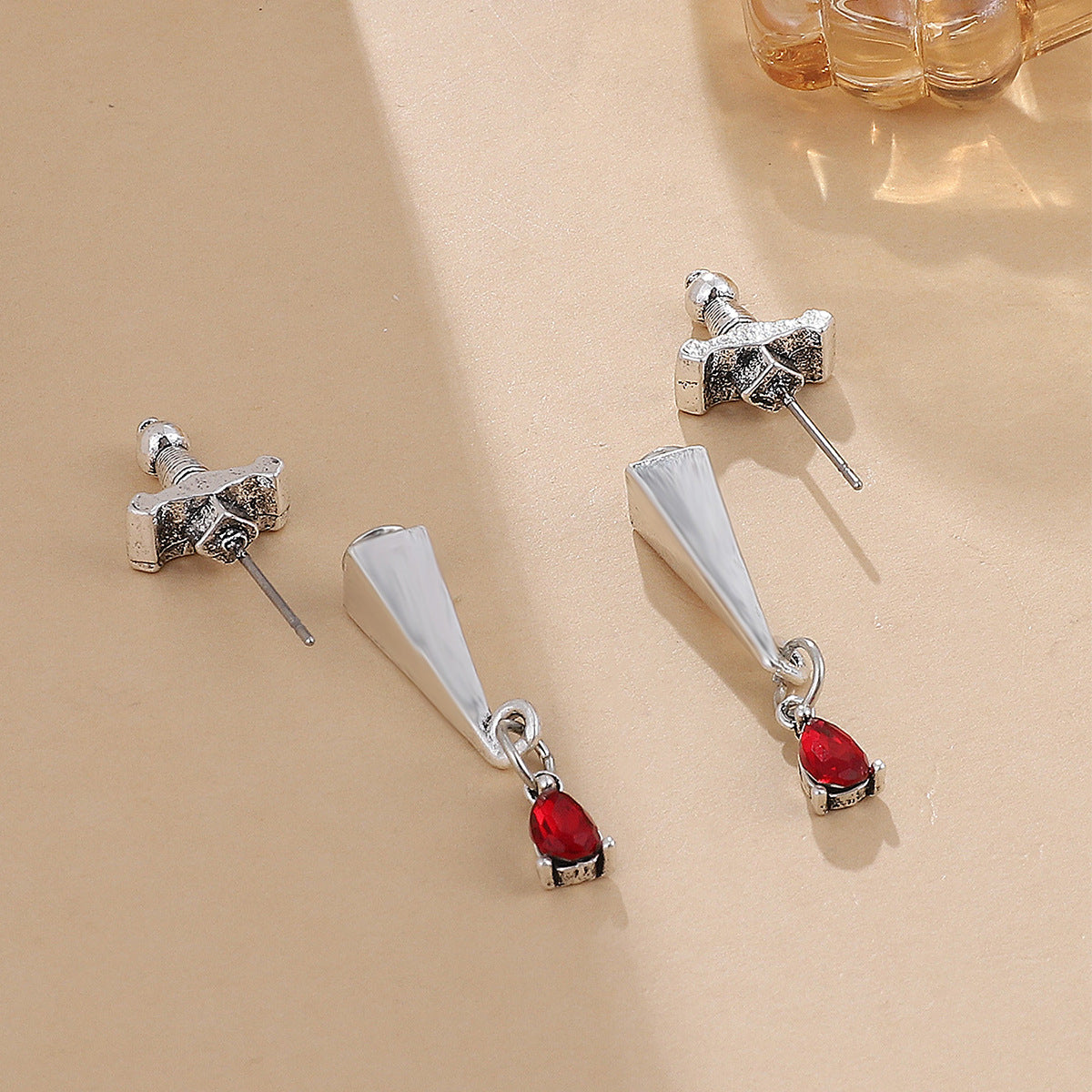 Red Crystal and Silver-Plated Sword Ear Jackets, silver drop earrings for women, botanical inspired, lifestyle look