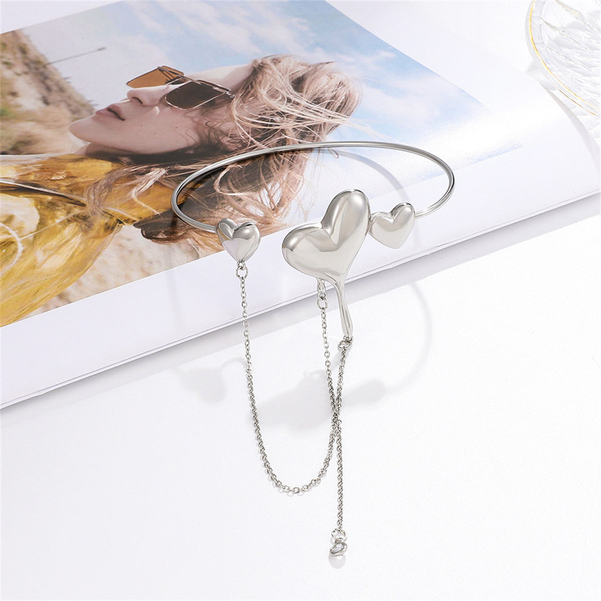 Clear Cubic Zirconia and Silver-Plated Hearts Arm Cuff, botanical inspired, detail close-up