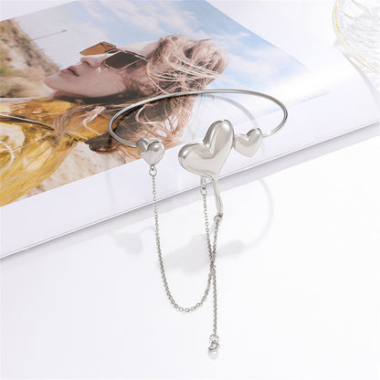 Clear Cubic Zirconia and Silver-Plated Hearts Arm Cuff, botanical inspired, detail close-up
