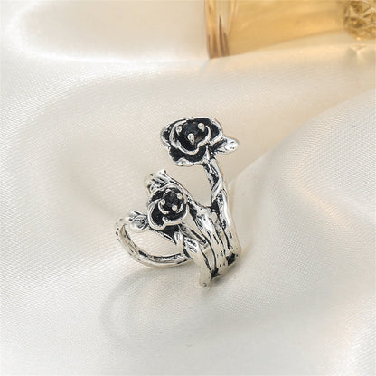 Black and Silver-Plated Rose Layered Ear Cuff, silver stud earrings for women, botanical inspired, detail close-up