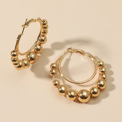 Beautifully crafted 18K gold-plated hoop earrings with beads, designed to make a statement and complement your style.
