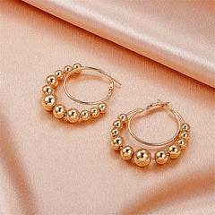 Stunning 18K gold-plated layered hoop earrings featuring colorful beads, ideal for elevating your jewelry collection.