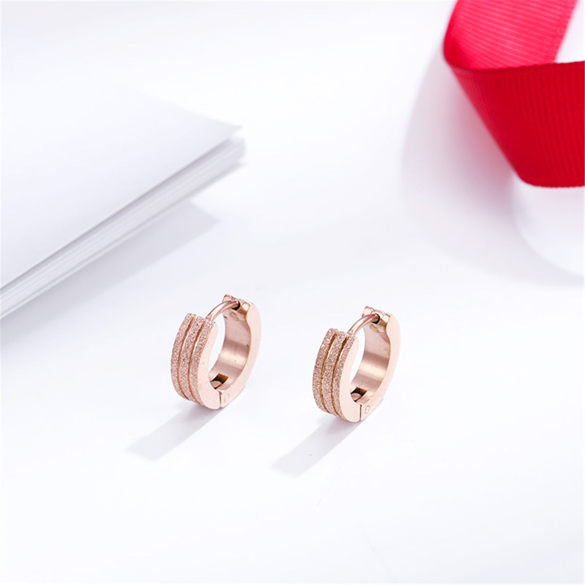 18K Rose Gold-Plated Frosted Huggie Earring, rose gold huggie earrings, dainty minimalist design, detail close-up