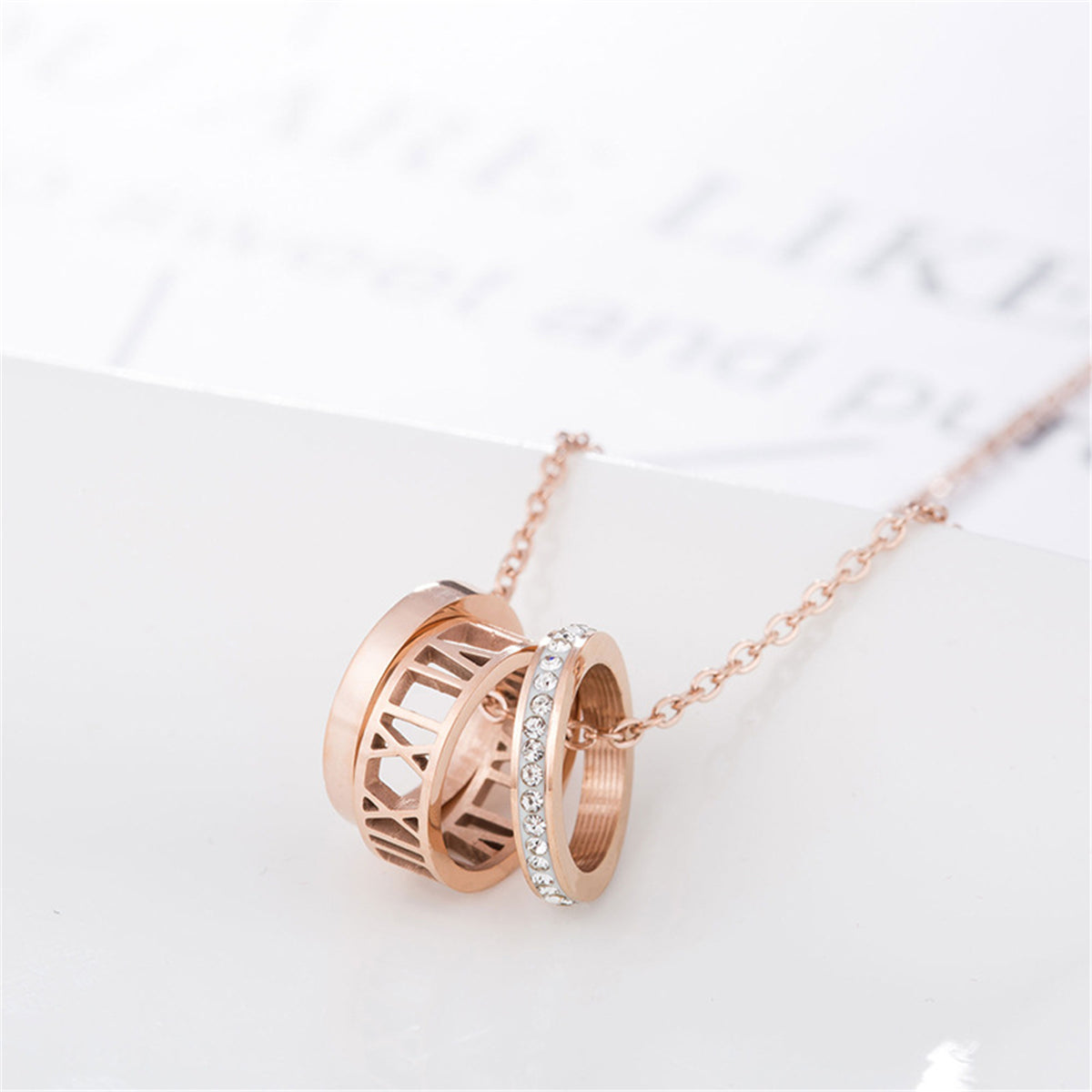 Cubic Zirconia and 18K Rose Gold-Plated Roman Numeral Pendant Necklace, rose gold pendant necklace for women, detail close-up