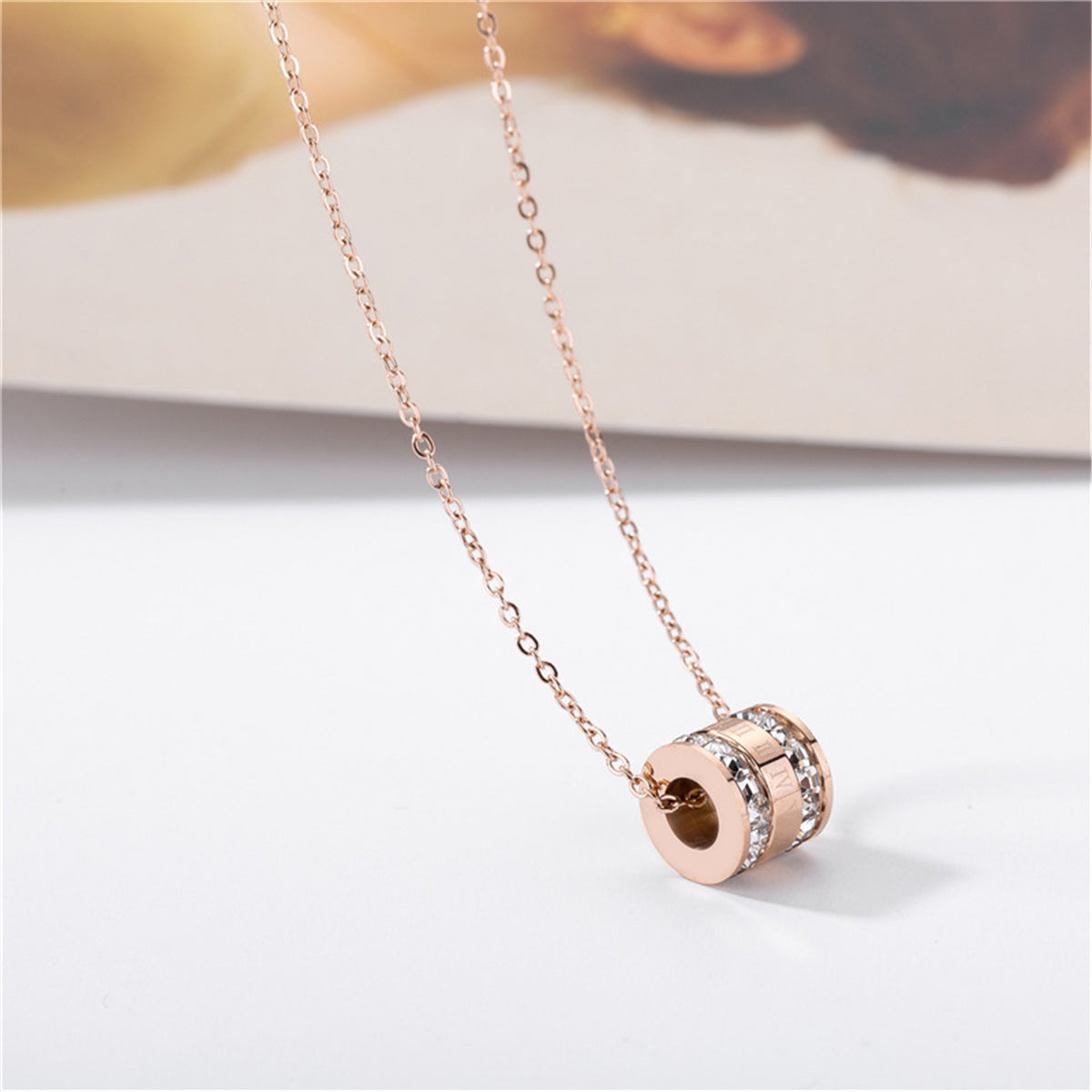 Crystal and 18K Rose Gold-Plated Roman Numeral Pendant Necklace, rose gold pendant necklace for women, detail close-up