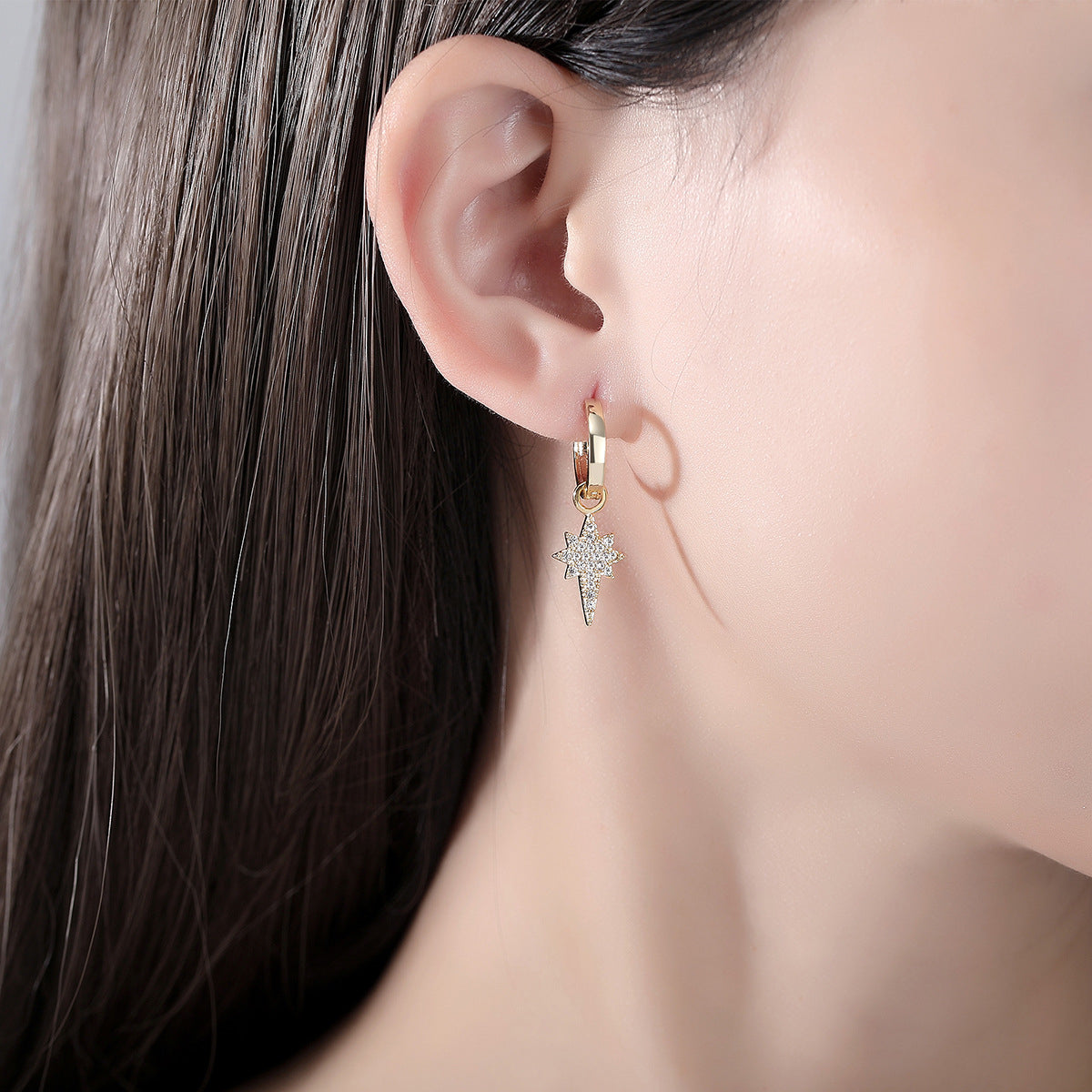 Cubic Zirconia and 18K Gold-Plated Star Huggie Earrings, gold huggie earrings, dainty minimalist design, side view