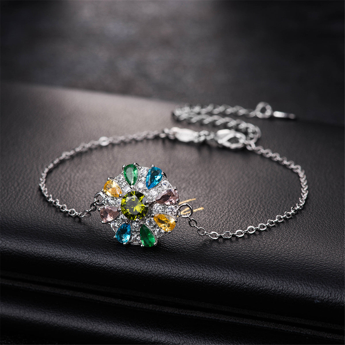 Blue Cubic Zirconia and Silver-Plated Flower Charm Bracelet, silver bracelet for women, dainty minimalist design, side view