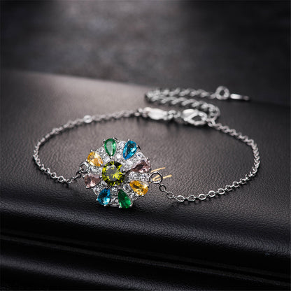 Blue Cubic Zirconia and Silver-Plated Flower Charm Bracelet, silver bracelet for women, dainty minimalist design, side view
