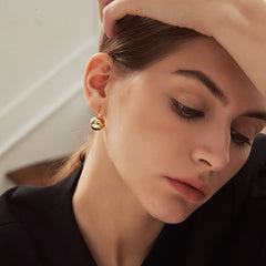 Dazzling 18K gold-plated ball huggie earrings, ideal for enhancing your jewelry collection with elegance.