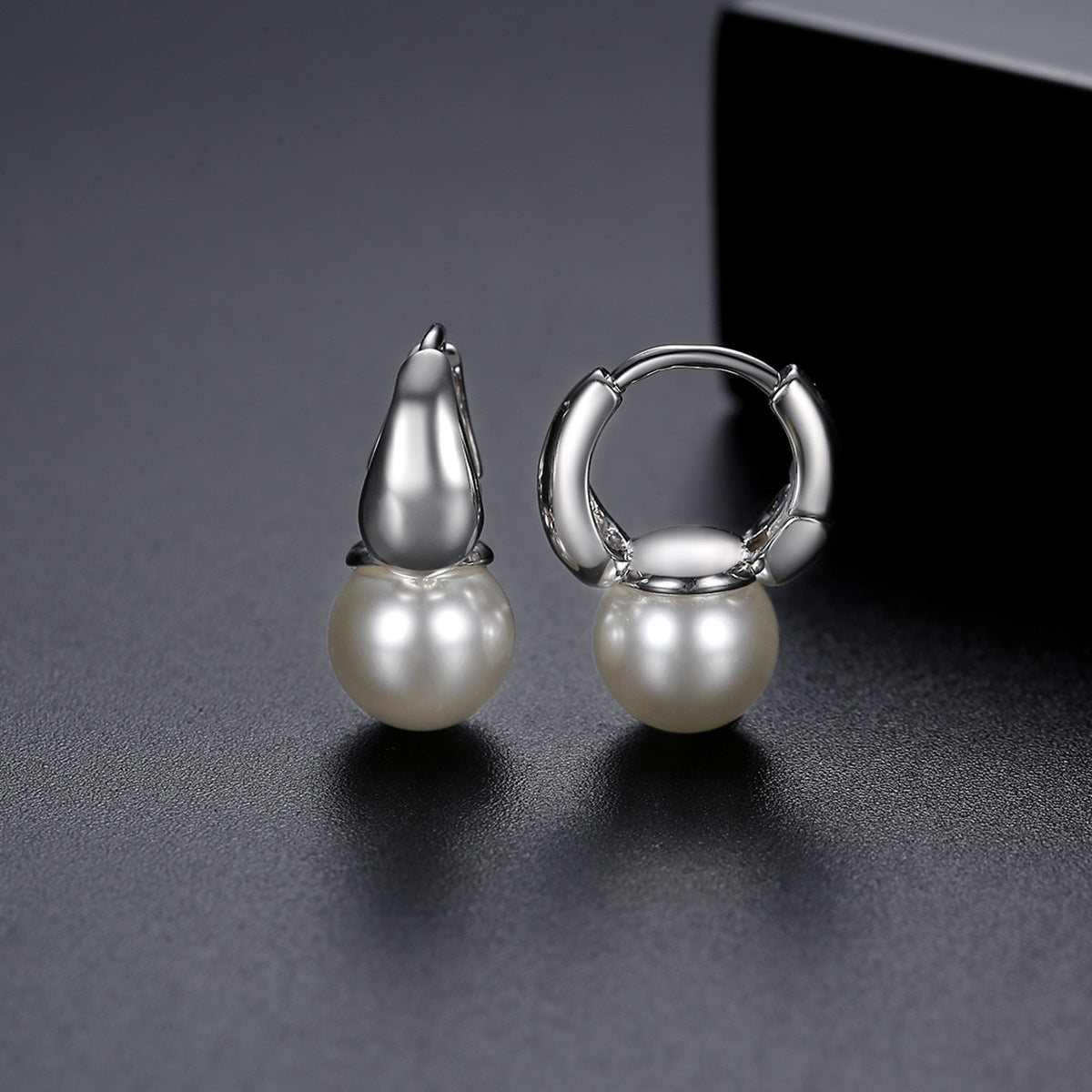 Pearl and Silver-Plated Huggie Earrings, silver huggie earrings, vintage-inspired design, detail close-up