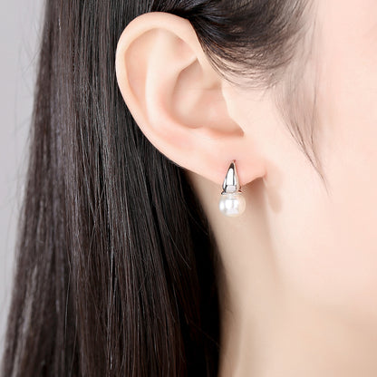 Pearl and Silver-Plated Huggie Earrings, silver huggie earrings, vintage-inspired design, lifestyle look