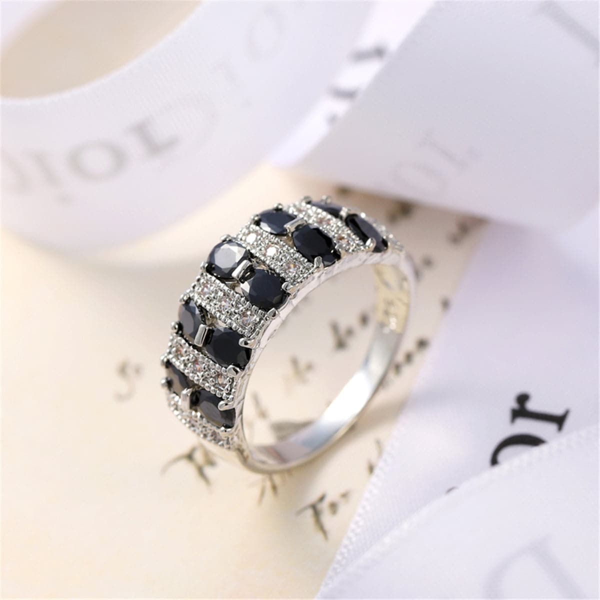 Black Crystal and Silver-Plated Invisible Ring, silver statement rings for women, botanical inspired, side view