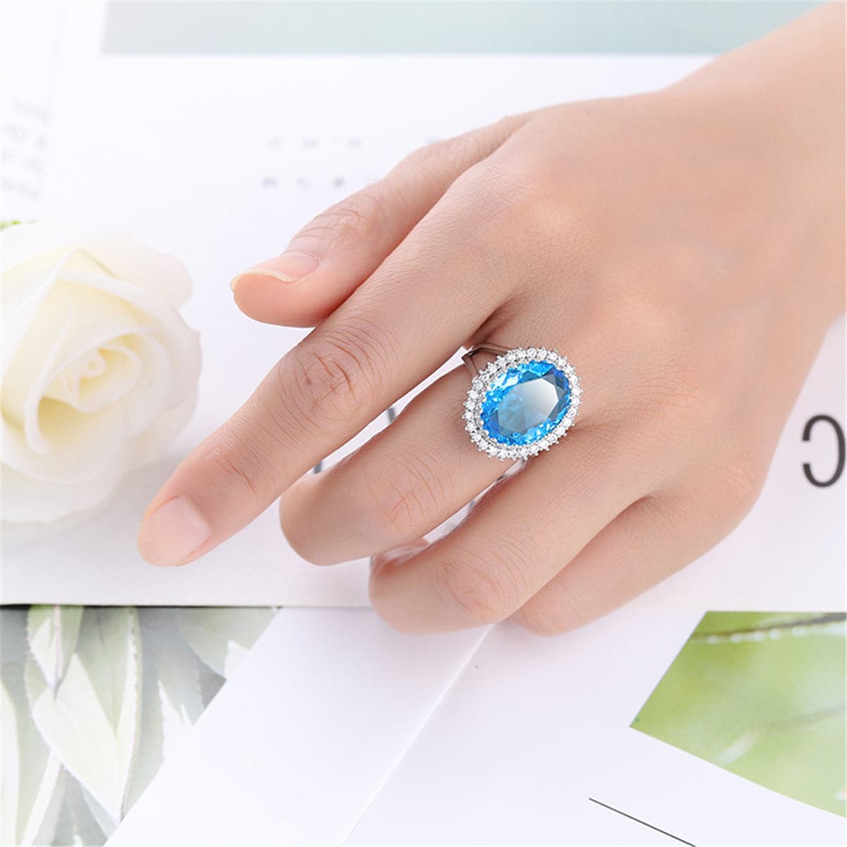 Sea Blue Crystal and Cubic Zirconia Oval-Cut Ring, statement rings for women, botanical inspired, side view