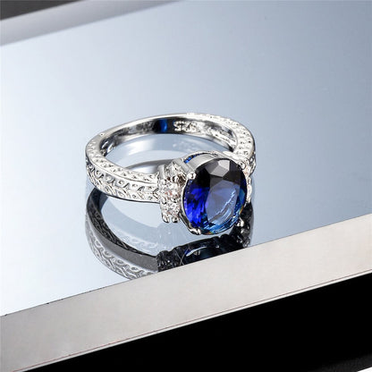 Navy Crystal and Cubic Zirconia Oval-Cut Flush-Band Ring, statement rings for women, botanical inspired, side view