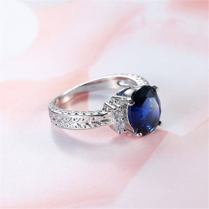 Navy Crystal and Cubic Zirconia Oval-Cut Flush-Band Ring, statement rings for women, botanical inspired, styled look