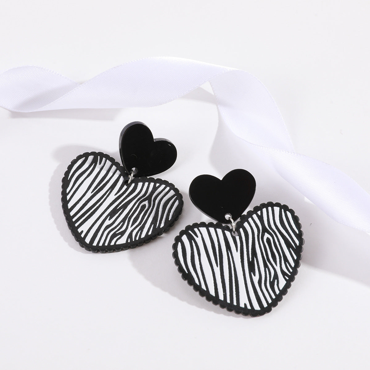 Black Acrylic and Silver-Plated Zebra Stripe Heart Drop Earrings, silver drop earrings for women, everyday style, side view