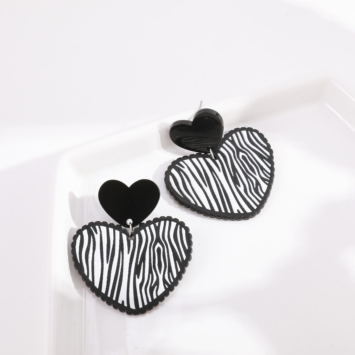 Black Acrylic and Silver-Plated Zebra Stripe Heart Drop Earrings, silver drop earrings for women, detail close-up