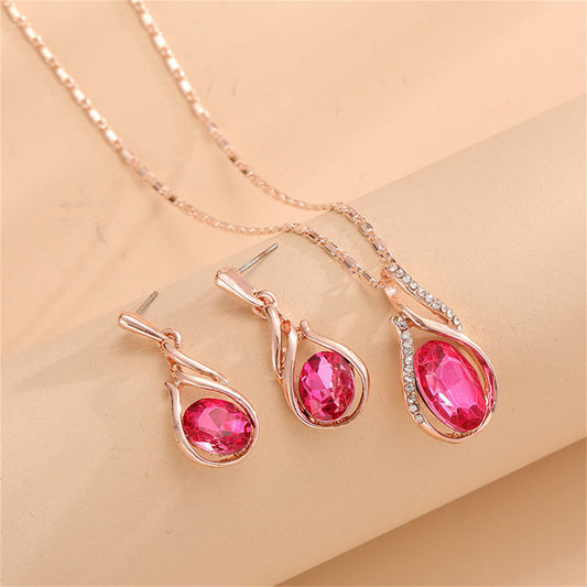 Red Crystal and Cubic Zirconia Pendant Necklace and Earrings, drop earrings for women, vintage-inspired design, front view