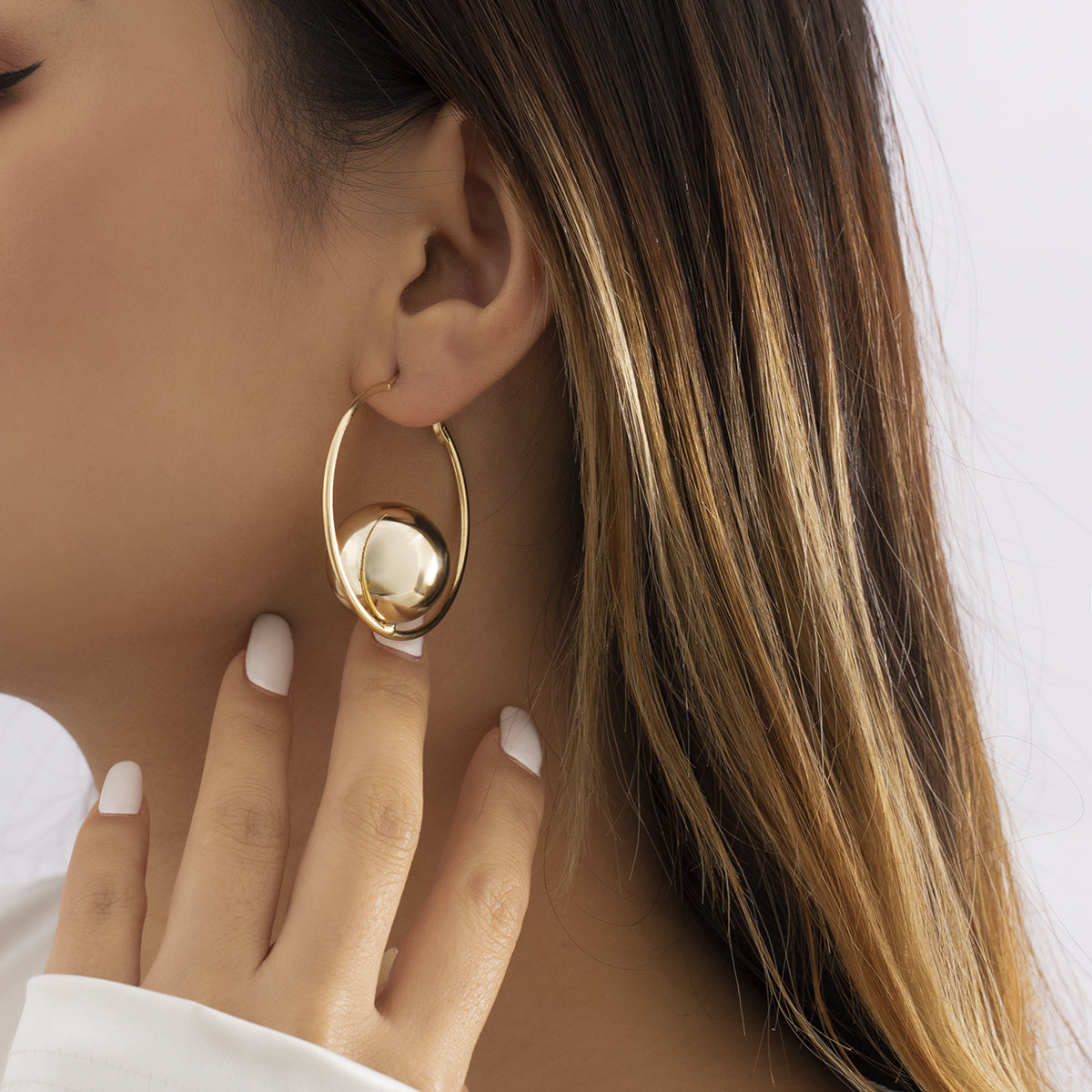 Elegant 18K gold-plated hoop earrings featuring a stylish ball accent at the end, perfect for any occasion.