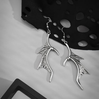 Silver-Plated Bat Wing Drop Earrings, silver drop earrings for women, vintage-inspired design, styled look
