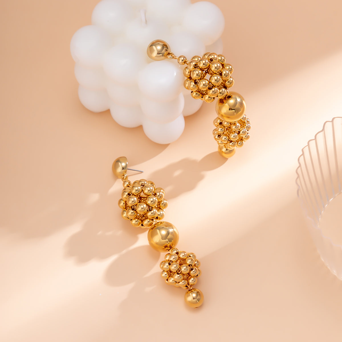 Beautifully crafted 18K gold-plated drop earrings with a cluster of beads and balls, adding elegance to your outfit.