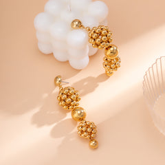 Beautifully crafted 18K gold-plated drop earrings with a cluster of beads and balls, adding elegance to your outfit.