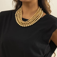 Elegant 18K gold-plated layered necklace featuring golden beads and a stylish chain, perfect for any occasion.