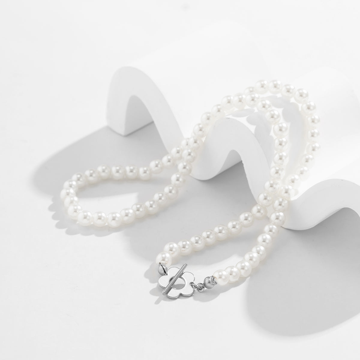 Pearl and Silver-Plated Flower Toggle Necklace, silver pendant necklace for women, botanical inspired, detail close-up
