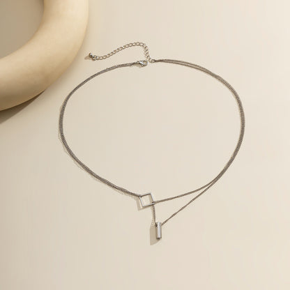 Silver-Plated Rhombus Layered Lariat Necklace, silver pendant necklace for women, vintage-inspired design, lifestyle look