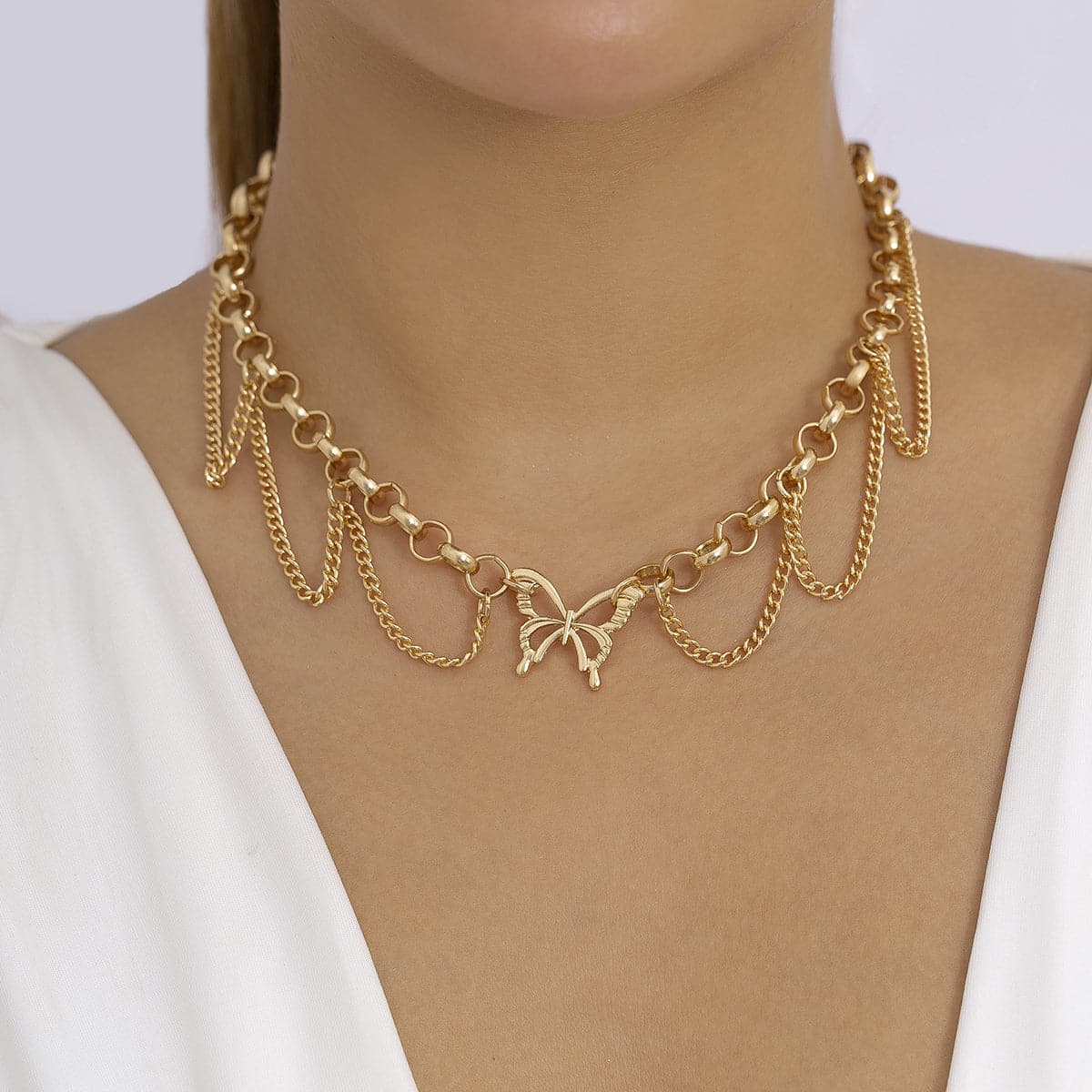 Elegant 18K gold-plated choker featuring a butterfly charm and delicate tassels, perfect for any stylish occasion.