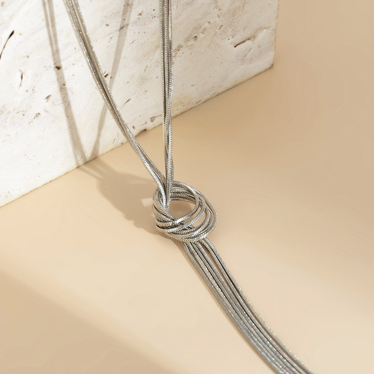 Silver-Plated Knotted Lariat Necklace, silver pendant necklace for women, vintage-inspired design, lifestyle look