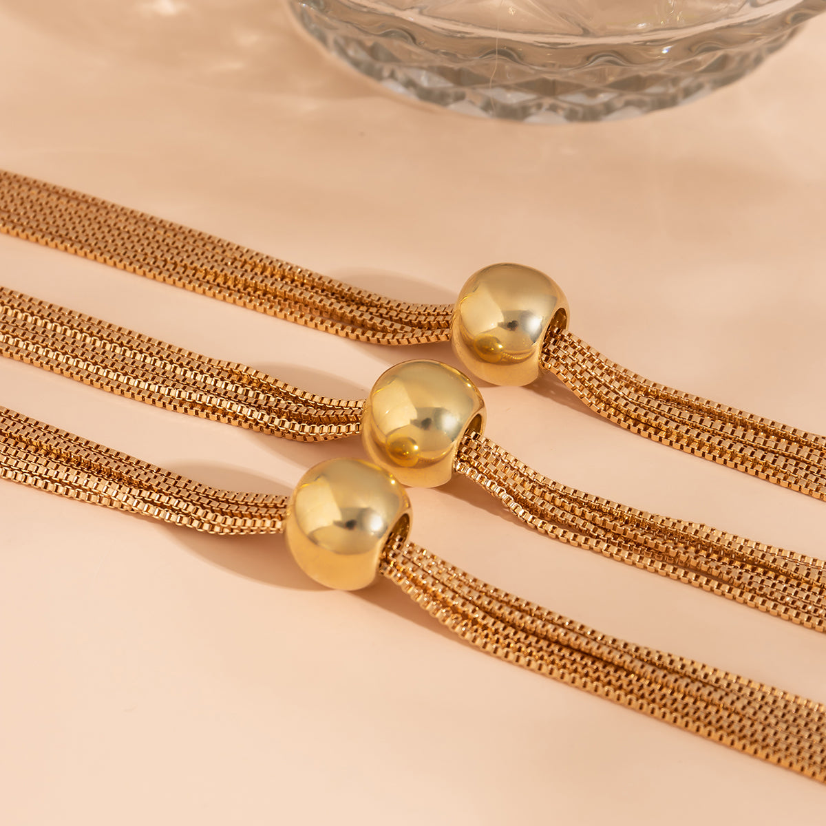 Beautifully crafted 18K gold-plated collar necklace with multiple strands, perfect for making a bold fashion statement.
