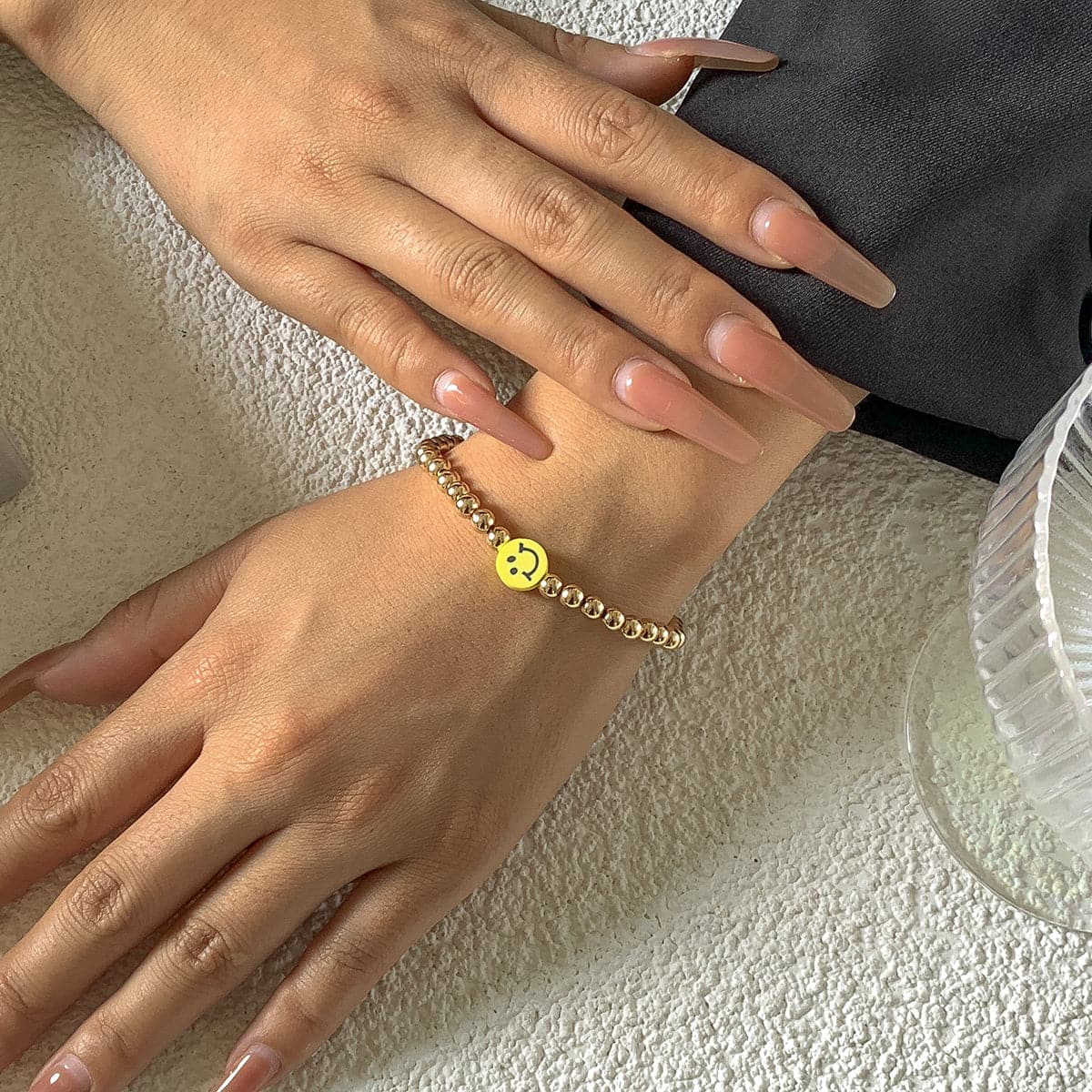 Acrylic and 18K Gold-Plated Smiley Charm Stretch Bracelet, gold bracelet for women, vintage-inspired design, detail close-up